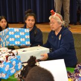 These Volunteers in Policing (VIPs) and students helped out at the annual "Reason for the Season."